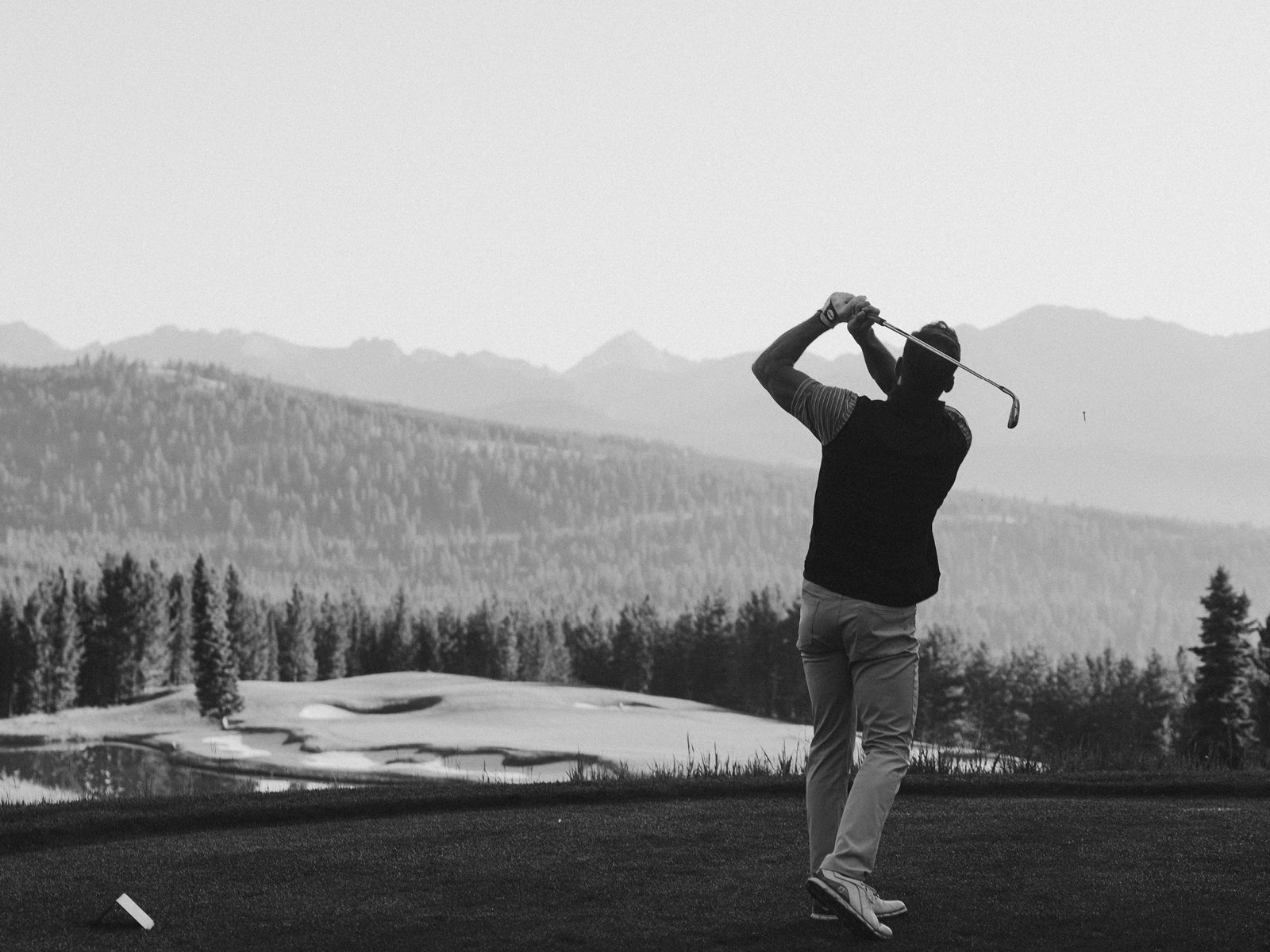 Man playing golf in GenTeal clothing