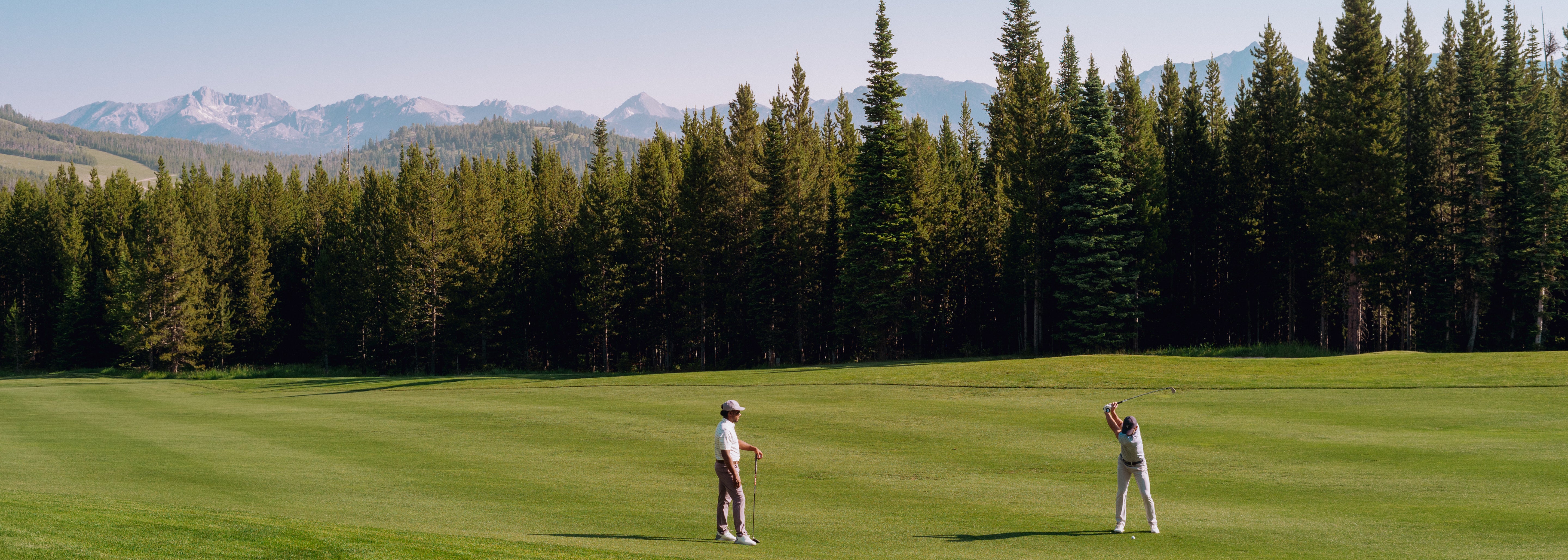 2 men playing golf in GenTeal clothing